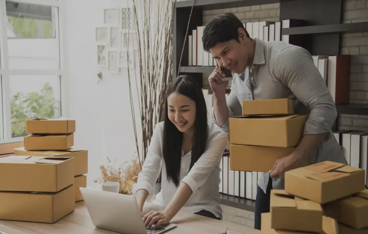 Man and Women with cardboard boxes